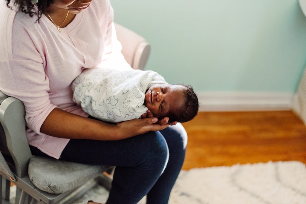 african-american baby newborn held by mom