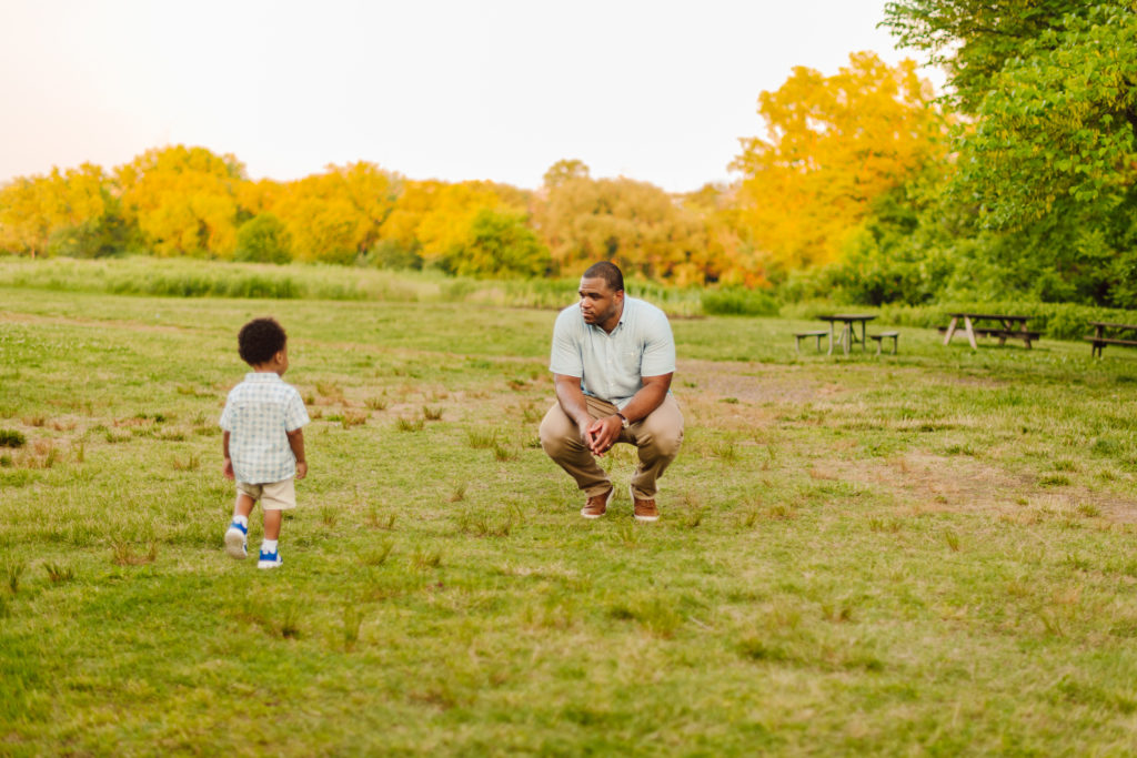 father and son play in bartram's garden