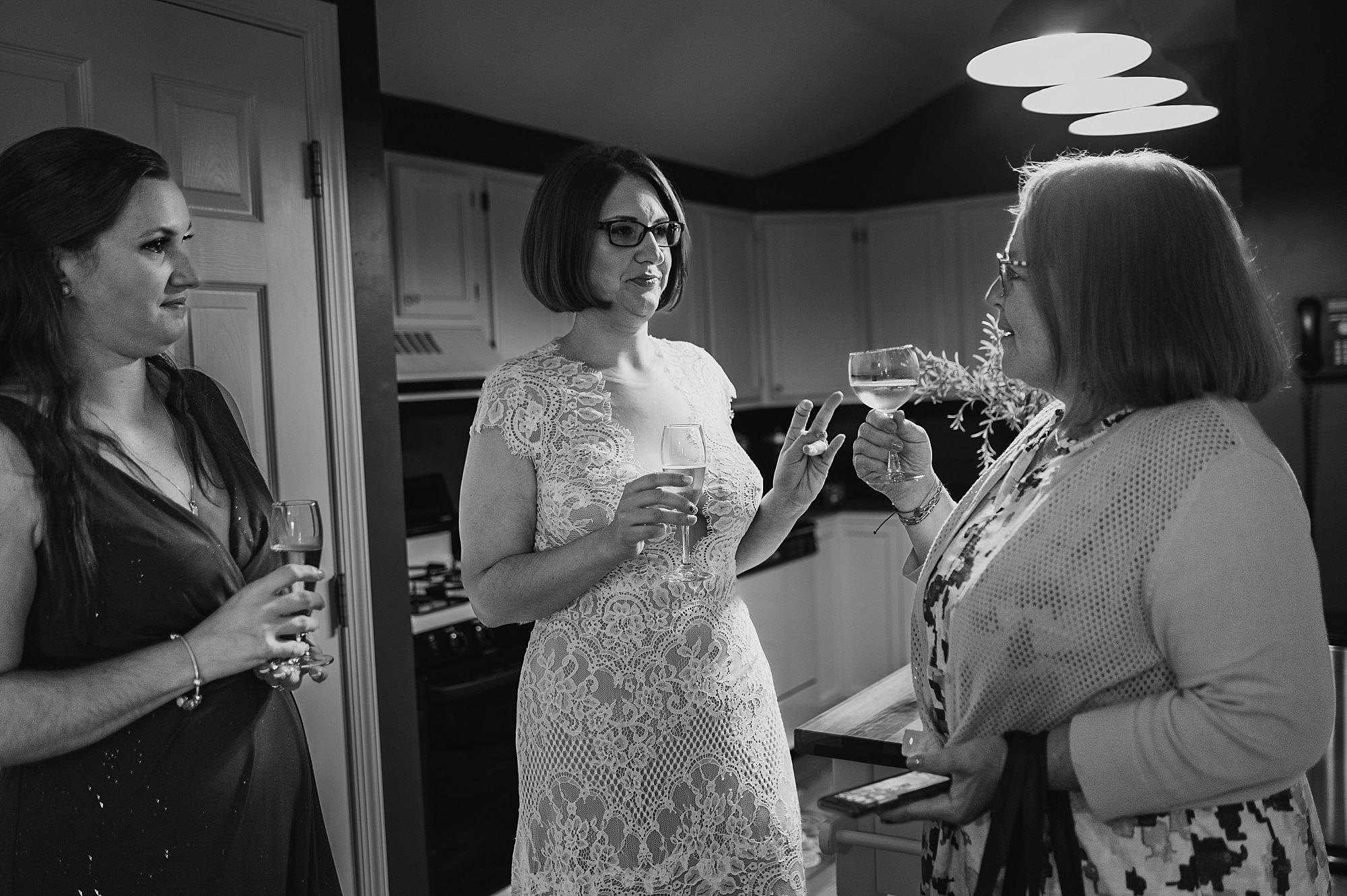 toasting bridal party crossing vineyards