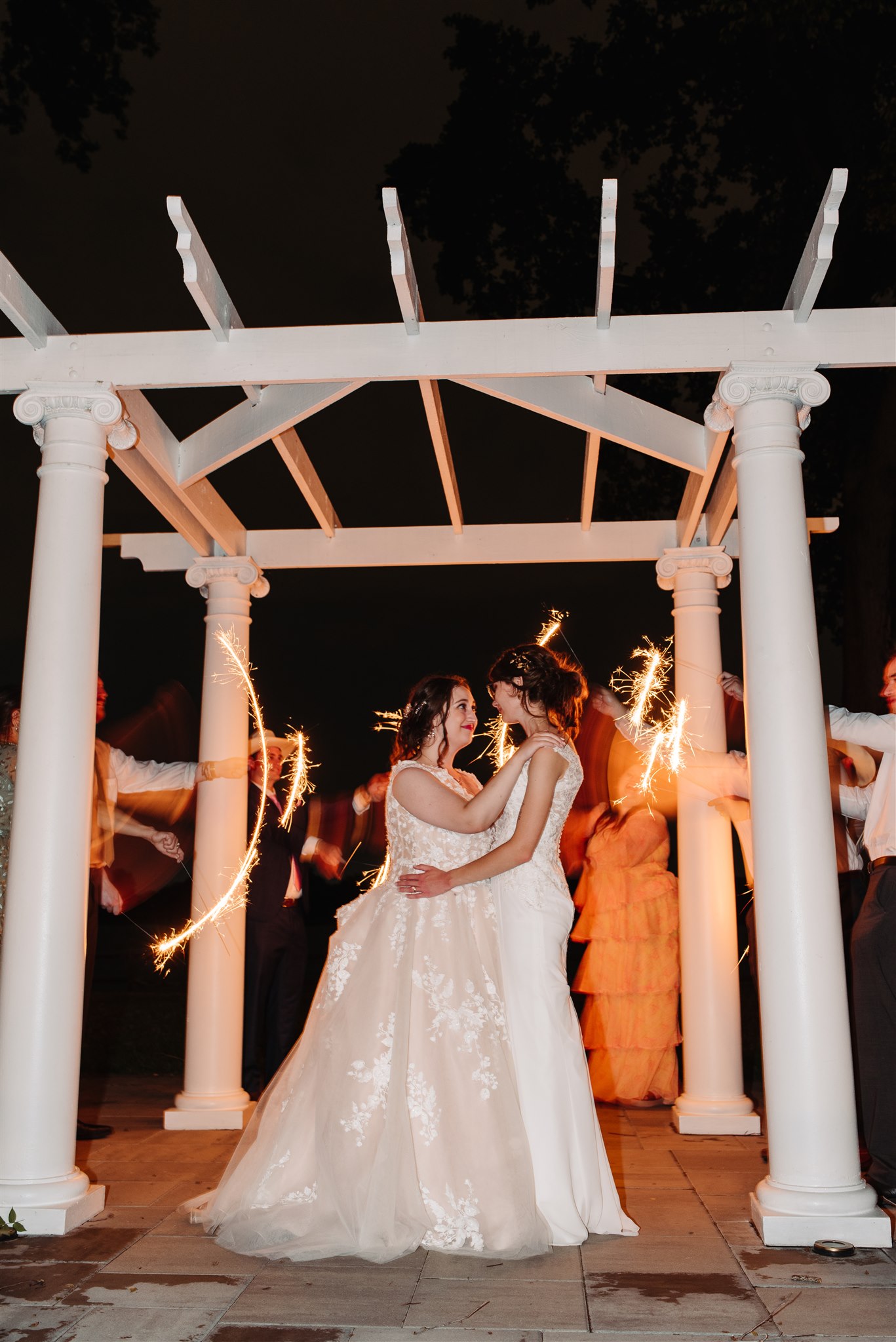 newlyweds sharing a private last dance at river’s edge – a romantic and emotional closing to the celebration.