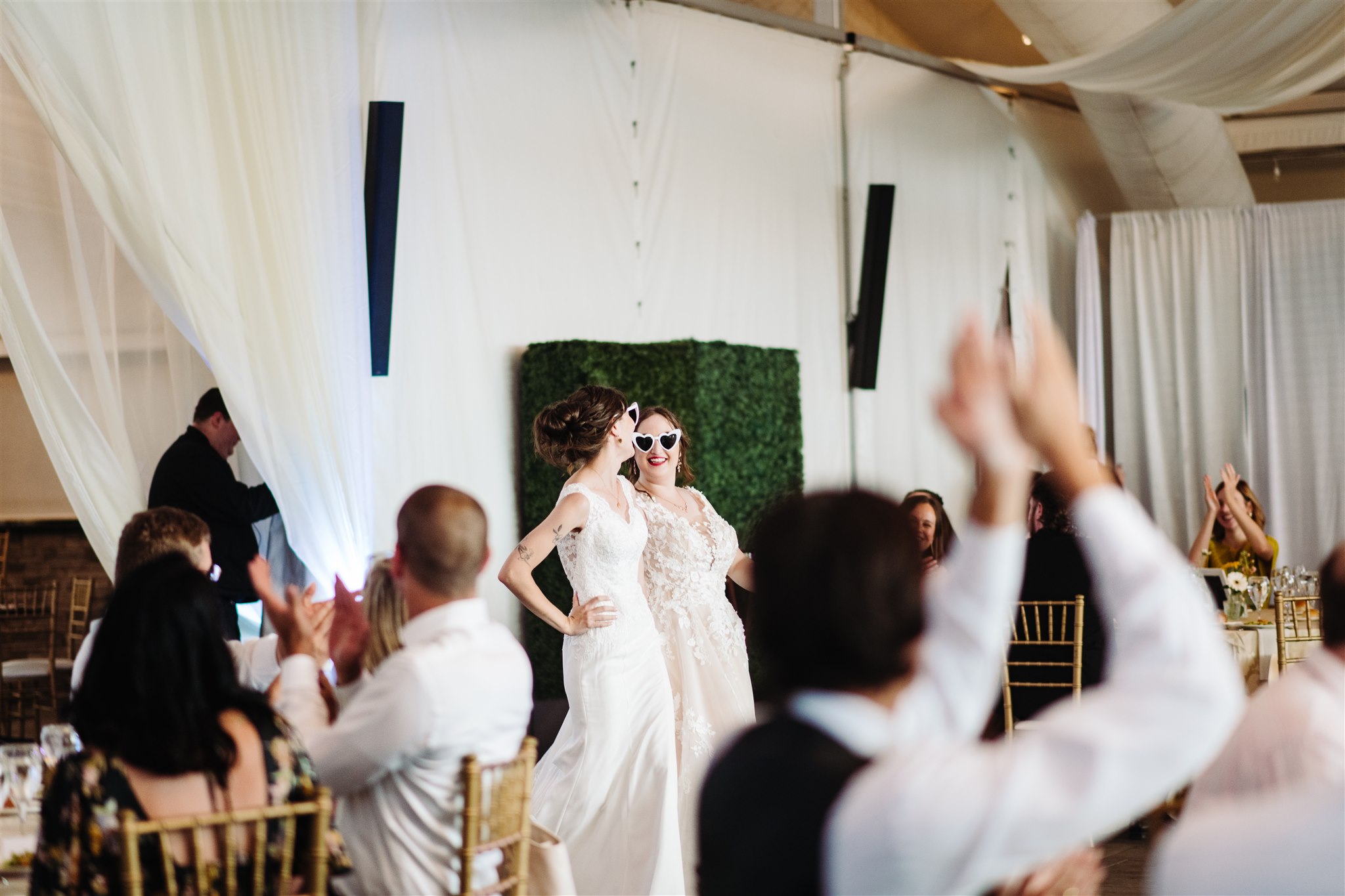 couple holding hands with the historic pen ryn mansion in the background – a perfect blend of love and timeless architecture.