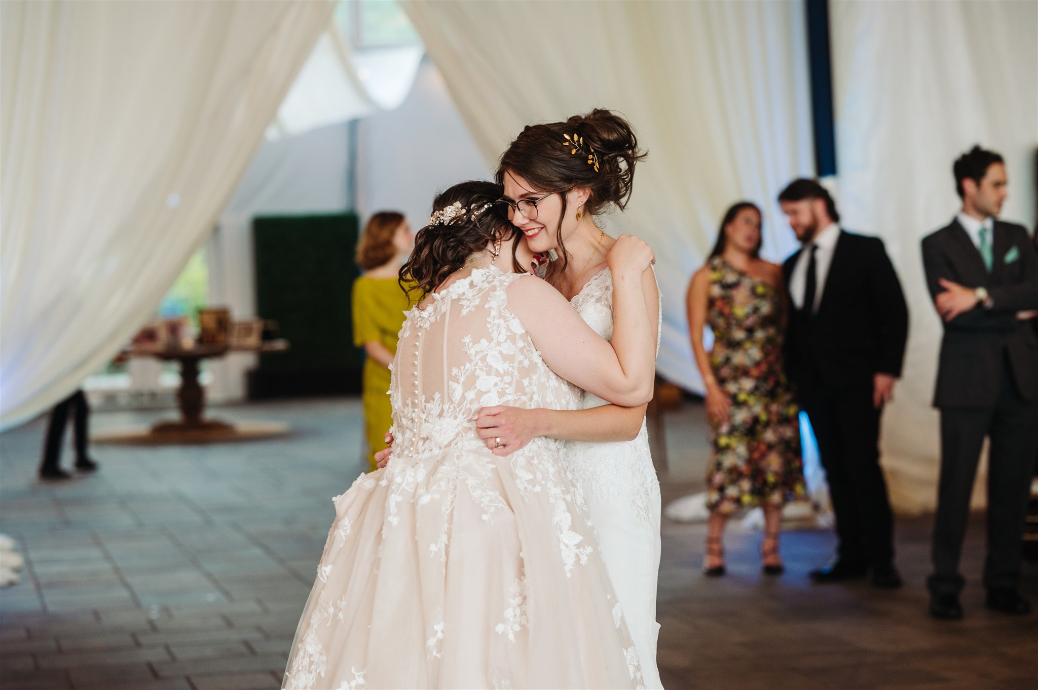 fine art wedding portrait of a lgbtq+ couple at river’s edge – elegant and timeless wedding photography.