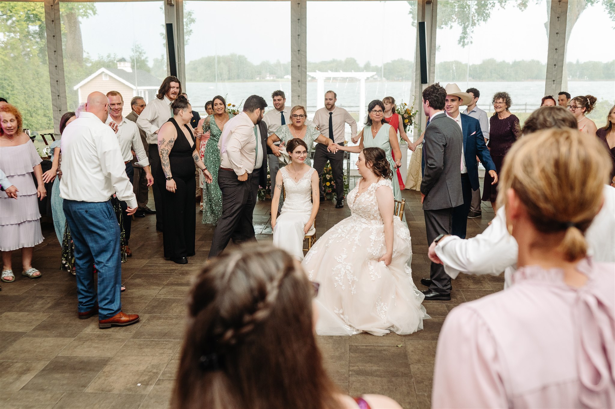 joyful reaction after the glass-breaking at a jewish queer wedding – a celebration filled with love and energy.