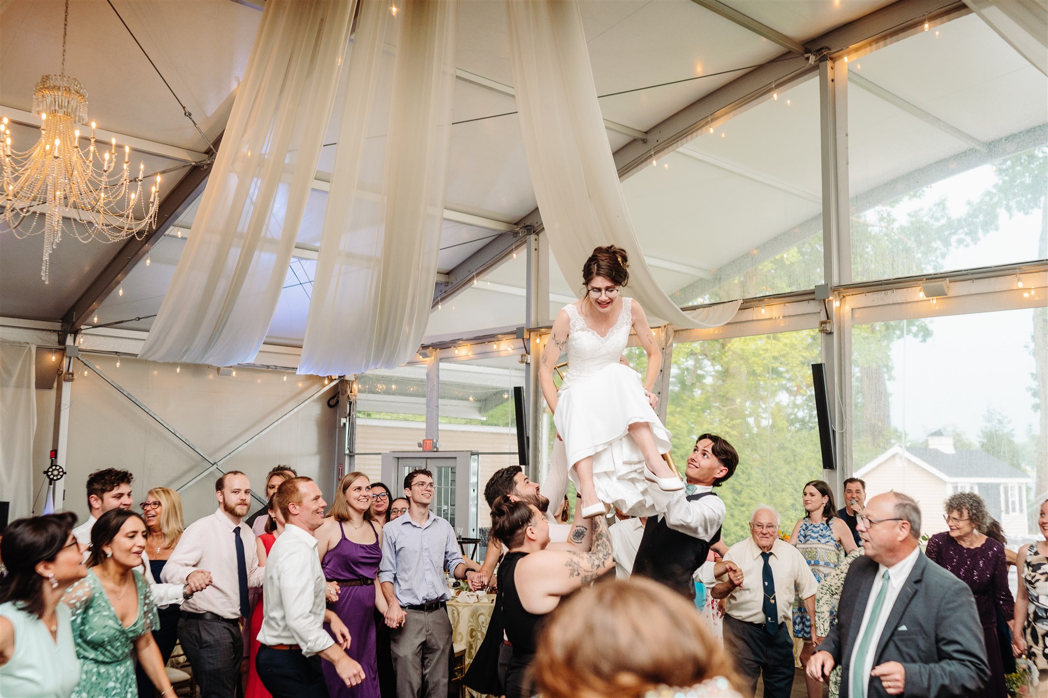 queer jewish wedding at pen ryn estate with floral chuppah – stunning spring florals and a riverfront backdrop.