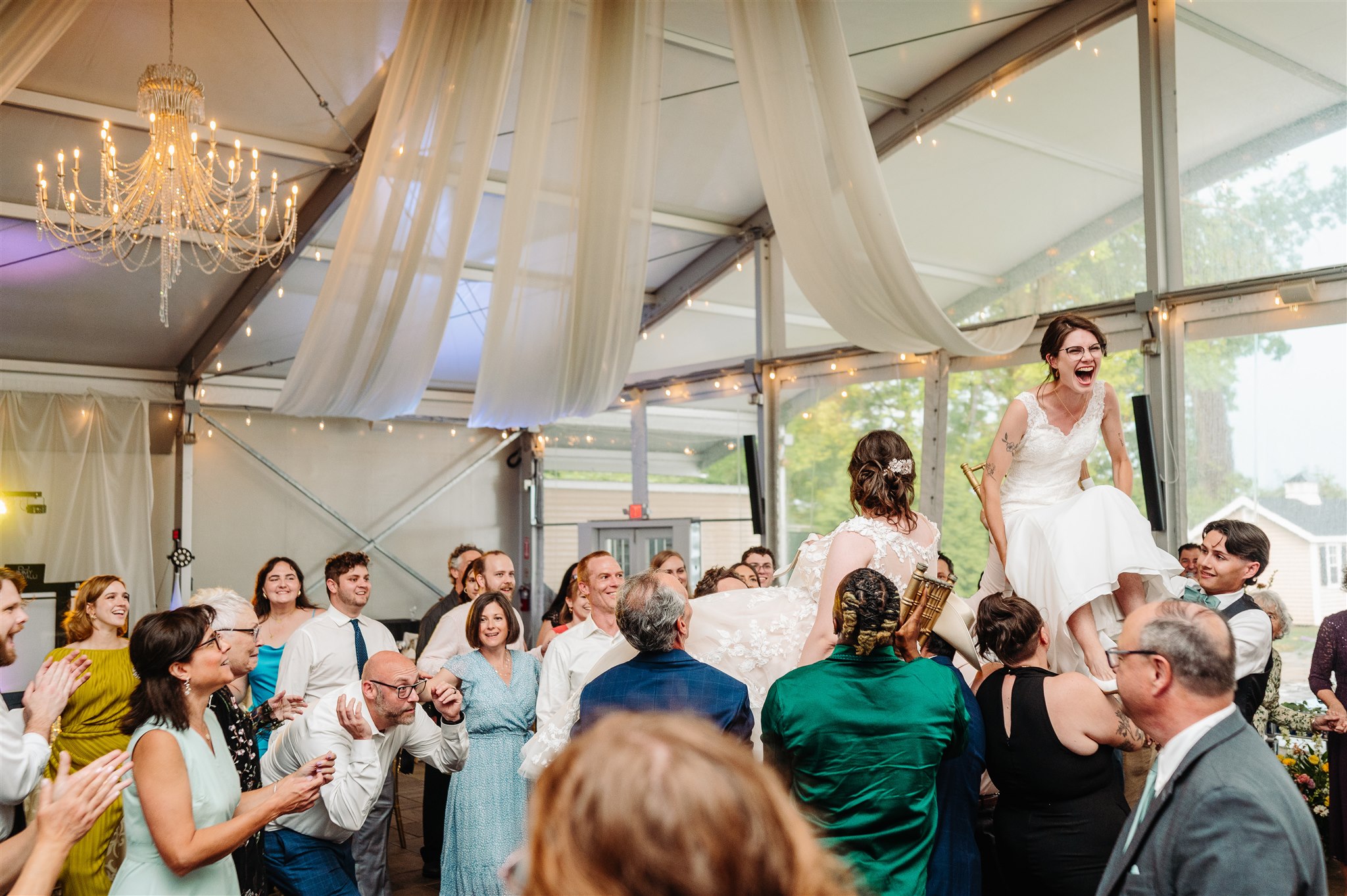 brides holding hands before their first look at pen ryn estate – anticipation and love captured beautifully.