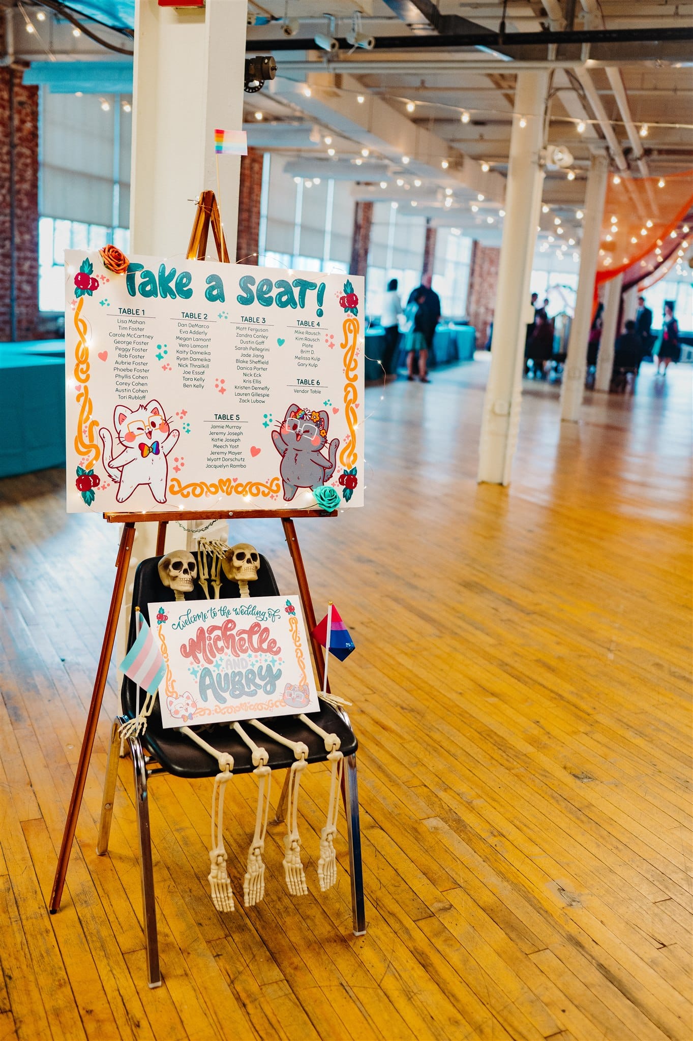 queer couple’s grand entrance into wedding reception: newlyweds beaming as they join their loved ones in a vibrant setting.