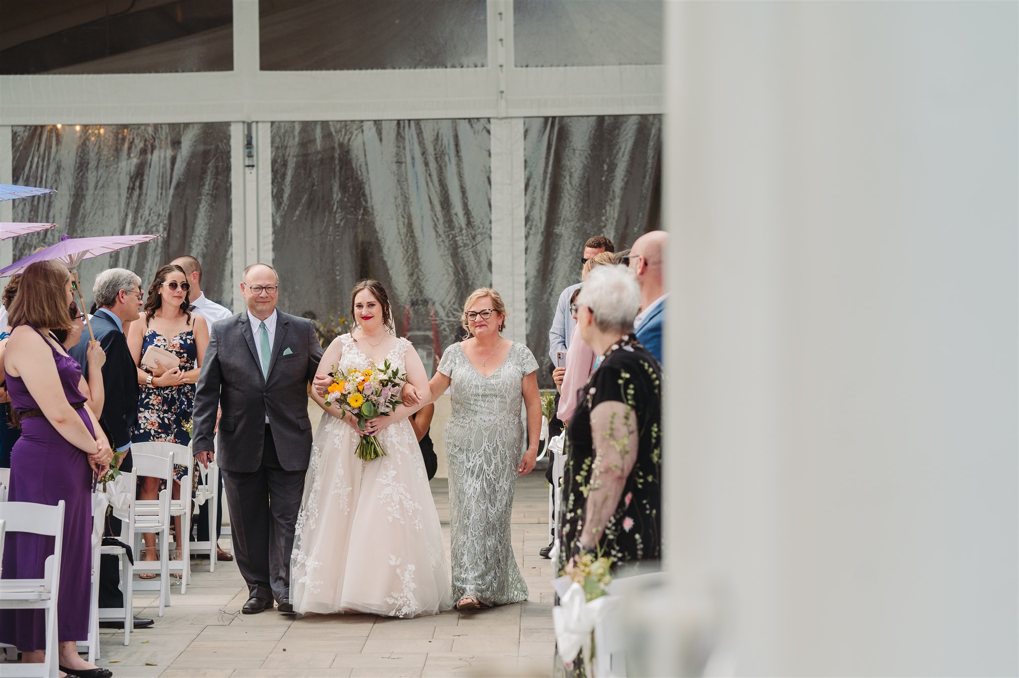 brides holding hands beneath the chuppah at pen ryn estate – a tender moment of unity and devotion.