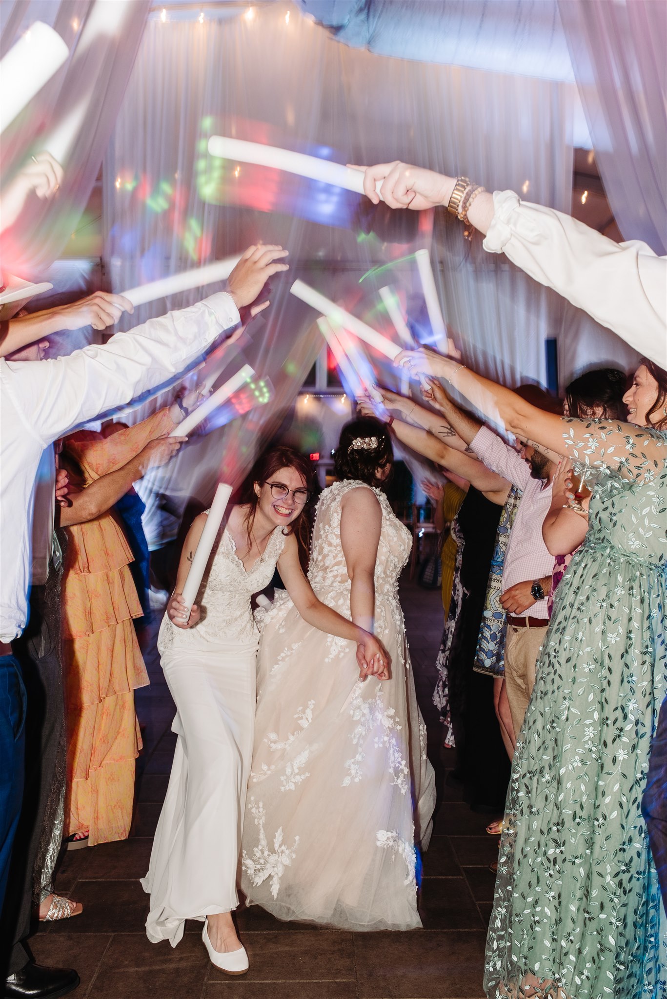 candid laughter between newlyweds at their wedding reception – pure love and happiness shining through.