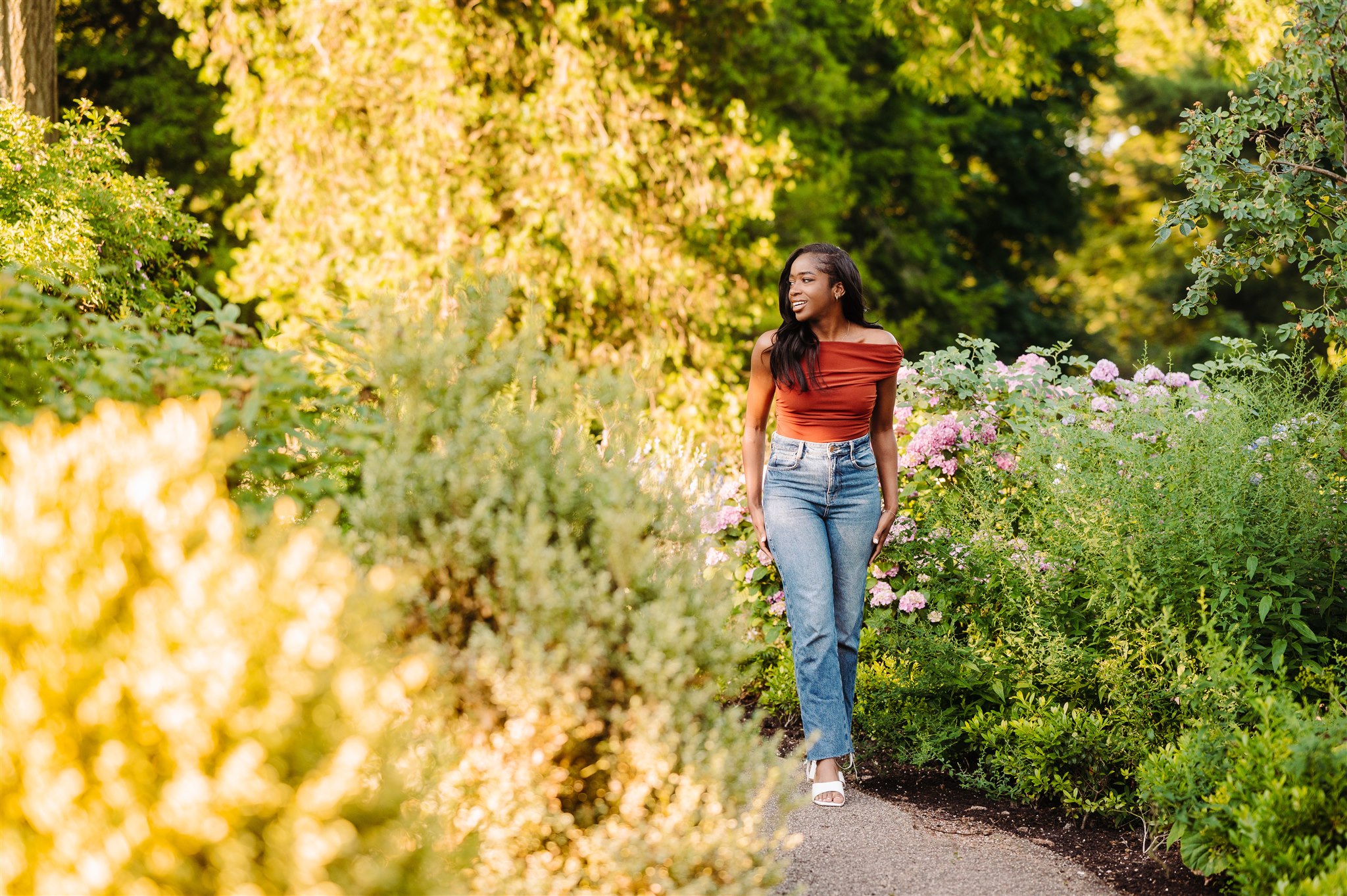 beautiful woman walking in bartram's garden for headshot photography