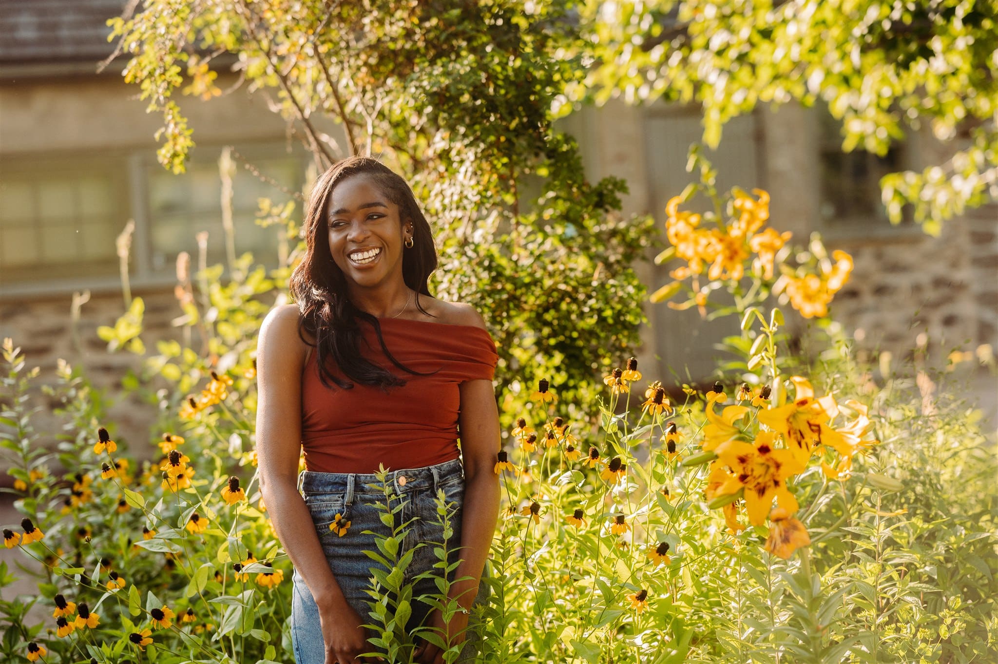 woman poses in golden hour in bartram's garden for headshots photography